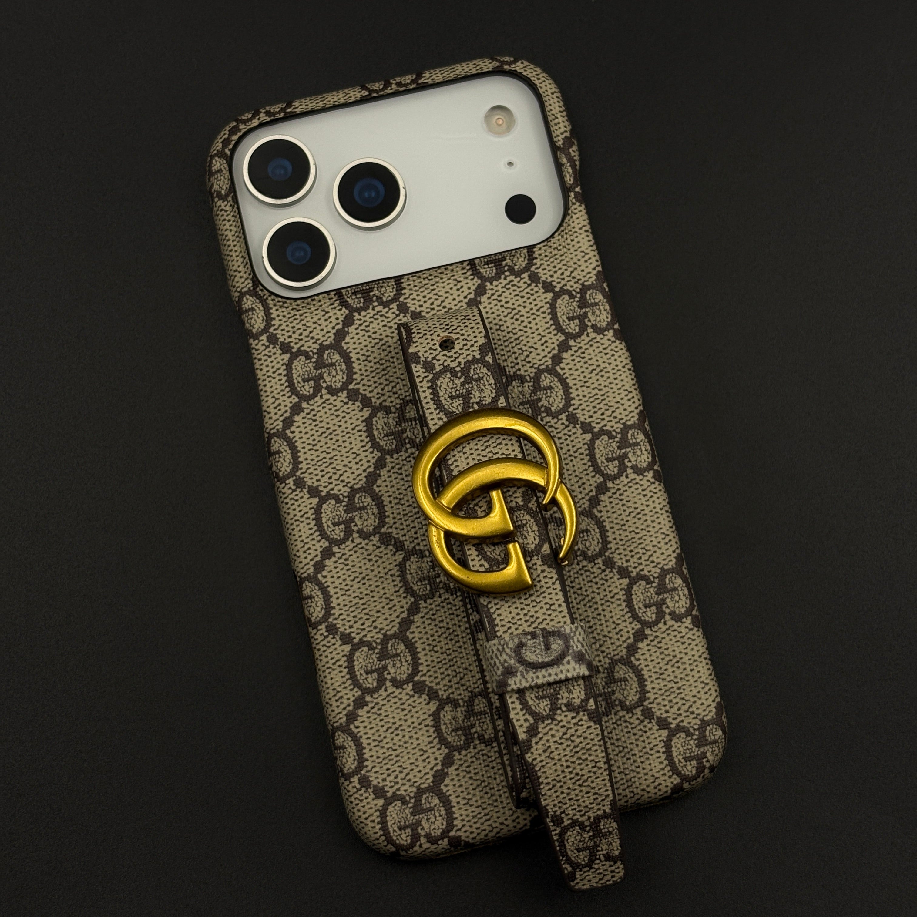 Luxury Brand GG Monogram Belt Strap Case with Gold Metal Emblem for iPhone 17 Series