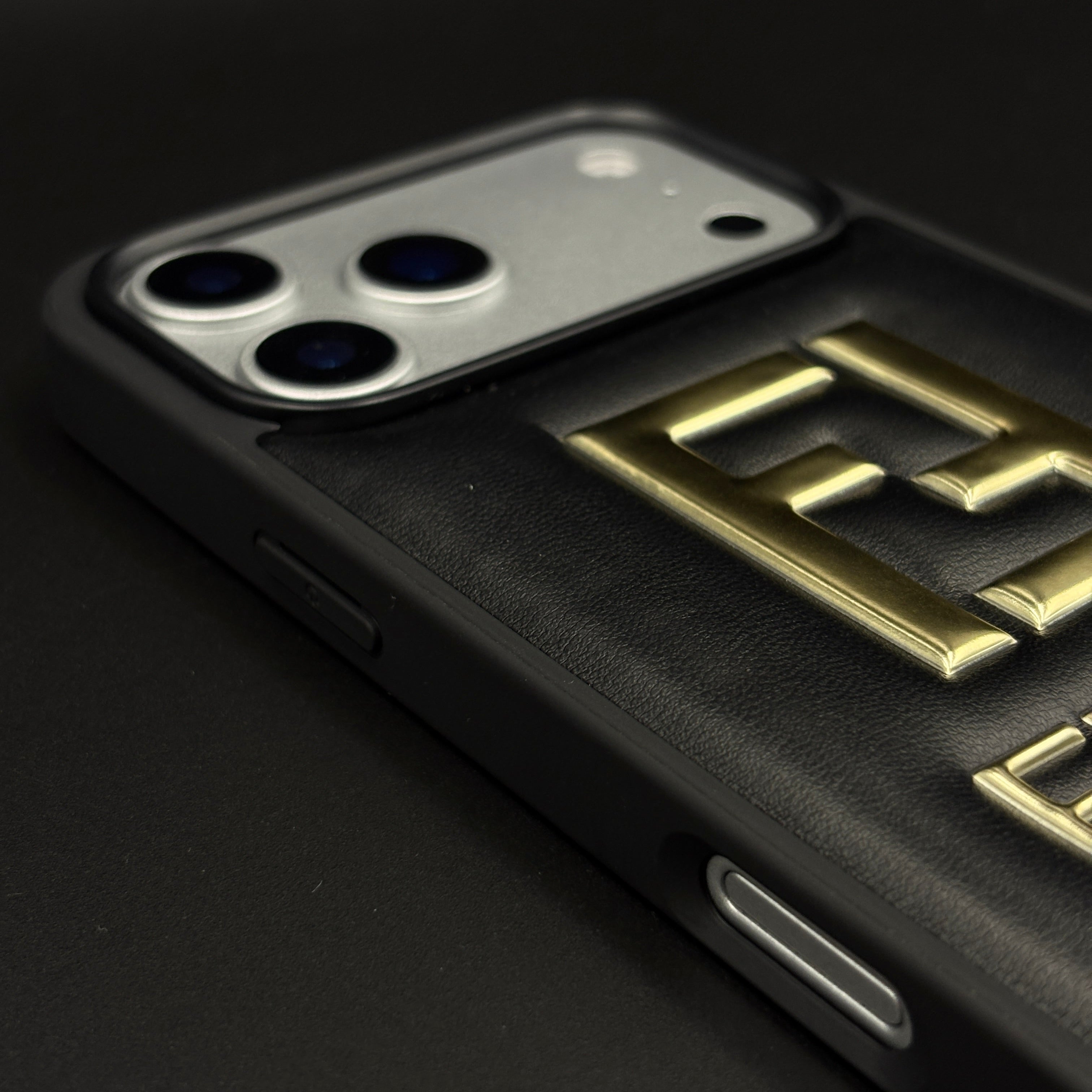 Gold Initial FF Emblem Puffer Mobile Case for iPhone 17 Series | Premium Black Cushion | Embossed Logo