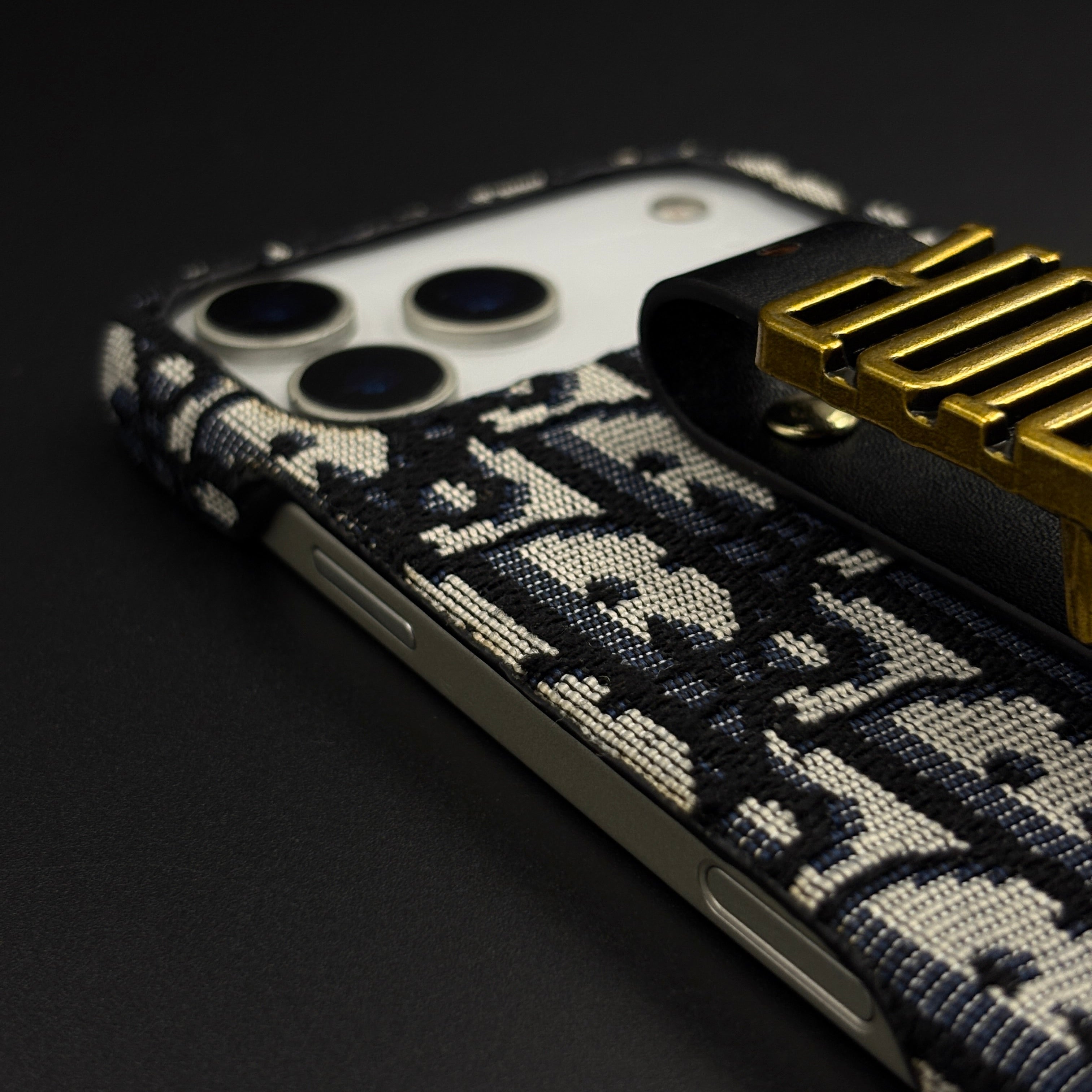 Luxury Fashion Brand Embroidered CD Belt Strap Case for iPhone 17 Series with Gold Metal Emblem