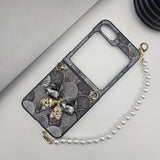Samsung Galaxy Z Flip 6 Sea Shell Pattern Bow Diamond Pearl Strap Holder Case