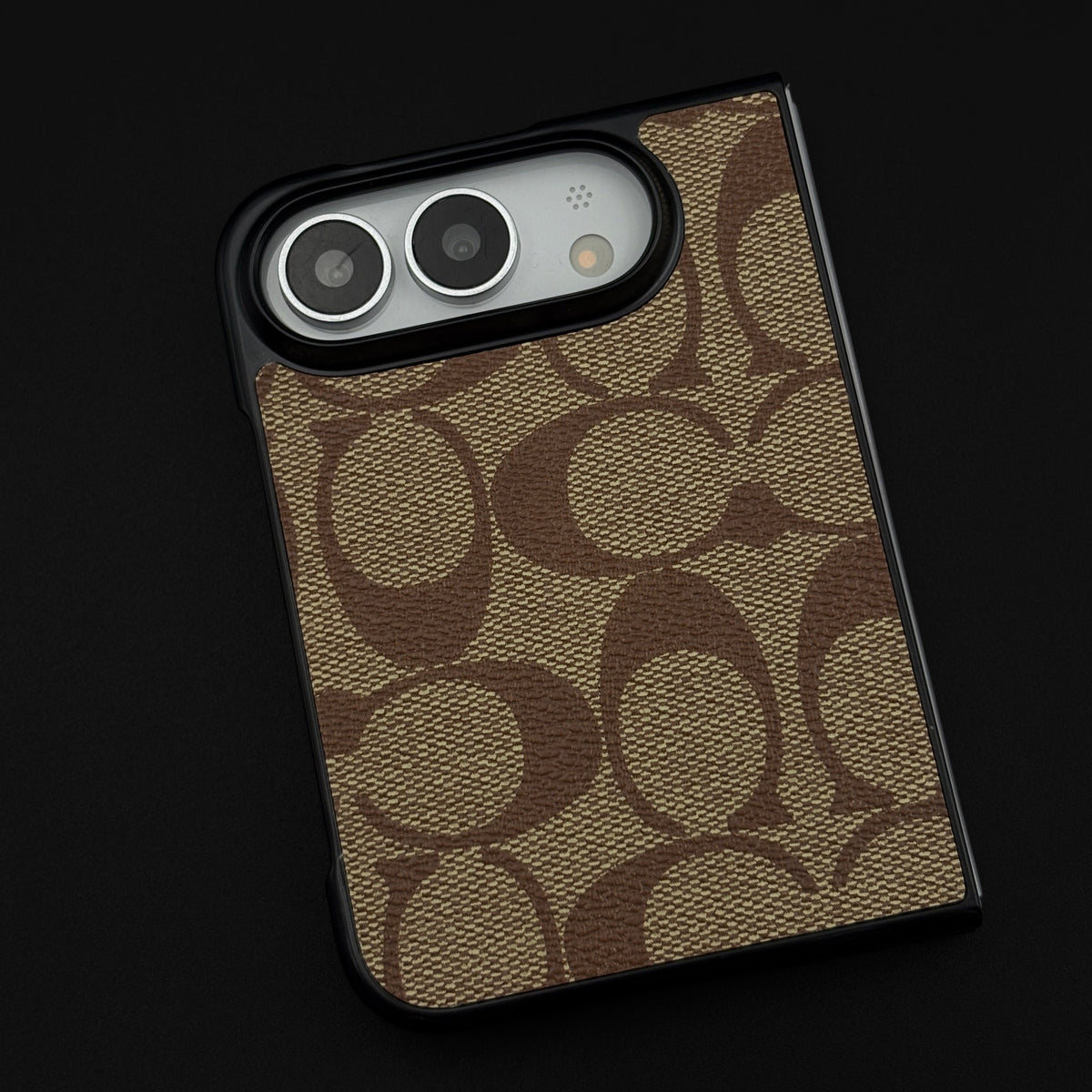 SeasonMade iPhone Duo case featuring a brown monogram CC pattern on premium PU leather with a black protective frame.